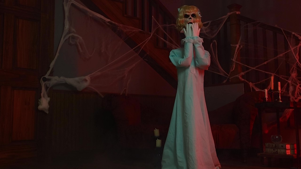 Don’t be fooled by her innocent stance—Peekaboo Penny is full of sinister surprises. Standing 5 feet tall, this animatronic child from Tekky suddenly lifts her hands to reveal a terrifying face and emits a blood-curdling scream that’ll send chills down anyone’s spine.